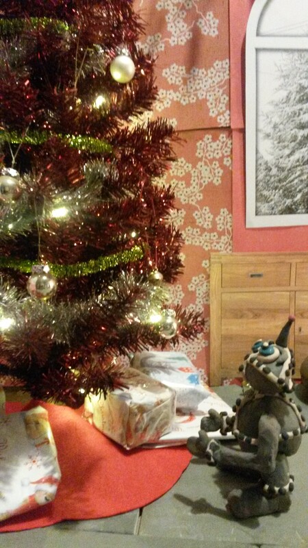 snapshot of the animated version of Bobby the Christmas Robot. Bobby looking up at the Christmas Tree.